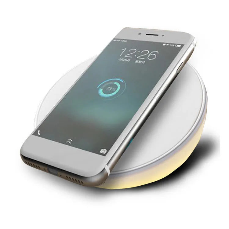 White 10W wireless phone charger with digital clock display and control buttons.