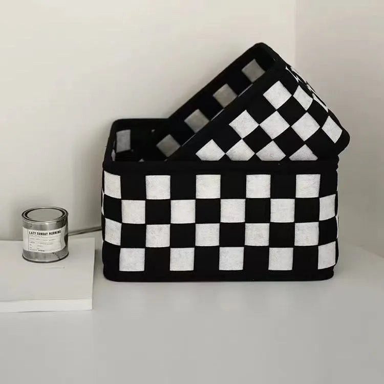 Checkerboard patterned grey felt folding storage basket with open top