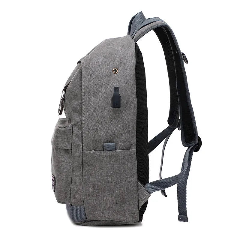 Canvas backpack with external USB charging port showing coffee colour option with multiple compartments.