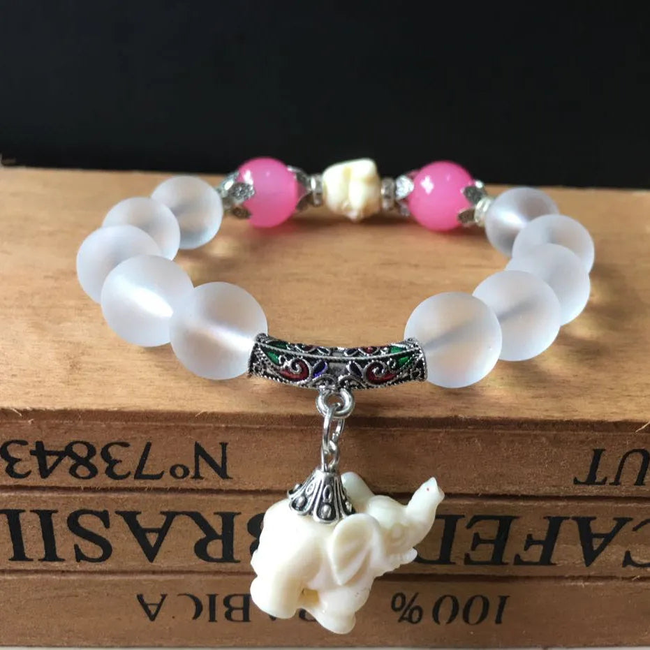 Crystal elephant charm bracelet with clear beads and gold finish metal charm