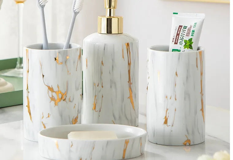 White ceramic bathroom wash kit with marble design showing two cups, latex bottle, and soap box