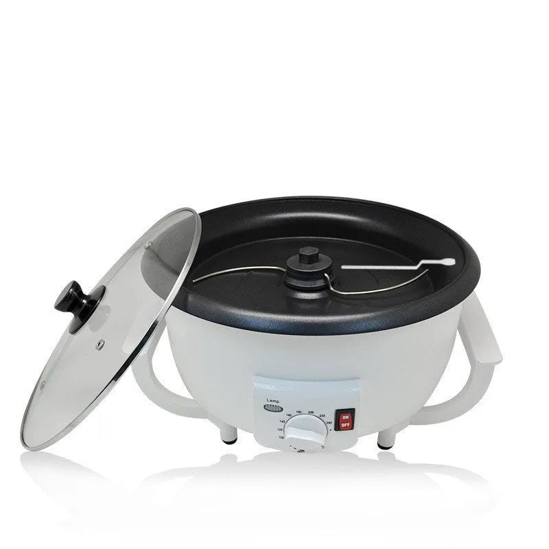 White oblate home coffee bean roasting machine with 750g capacity on a kitchen counter