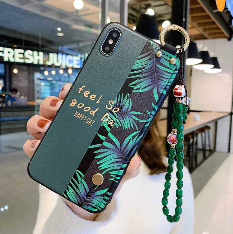 Samsung Galaxy phone case with folding bracket extended, showing floral pattern design