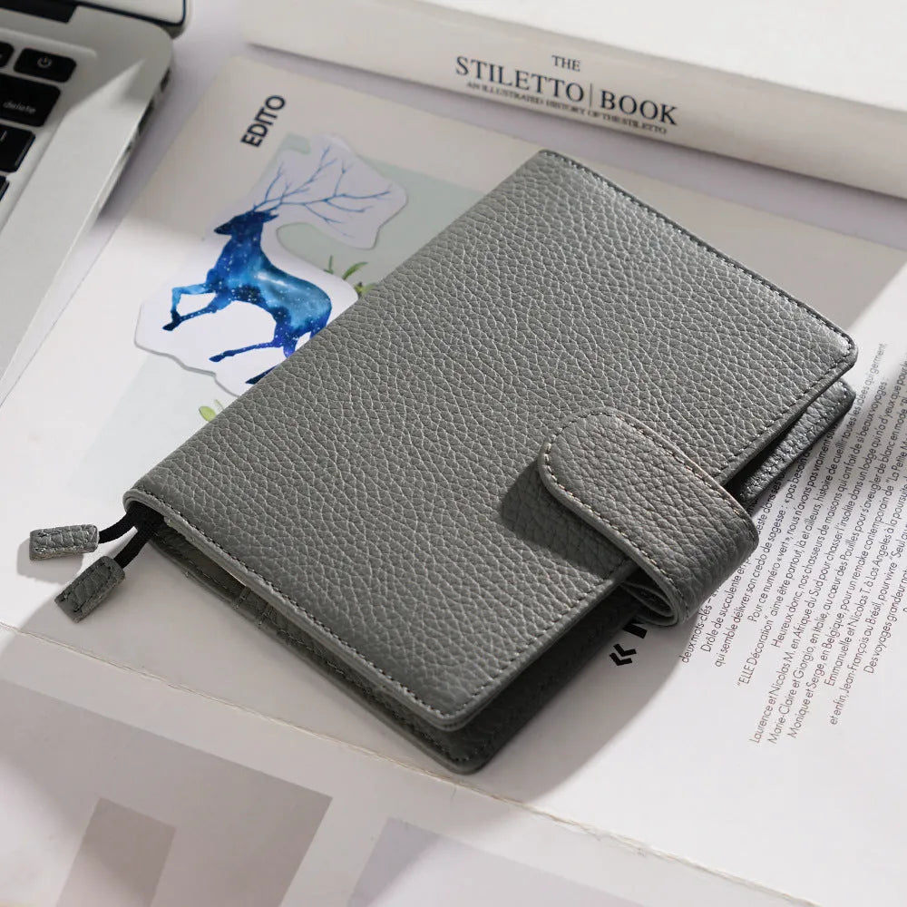 A6 loose-leaf diary with cowhide leather cover showing lychee pattern texture