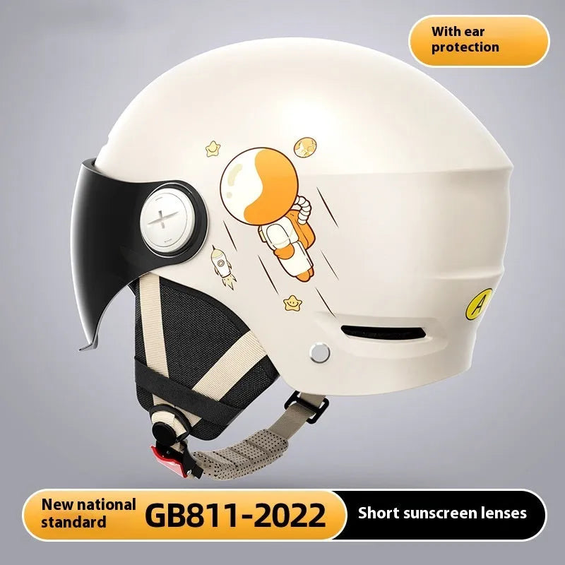 Khaki coloured open-face motorcycle helmet with integrated long mirror sunglasses on a table.