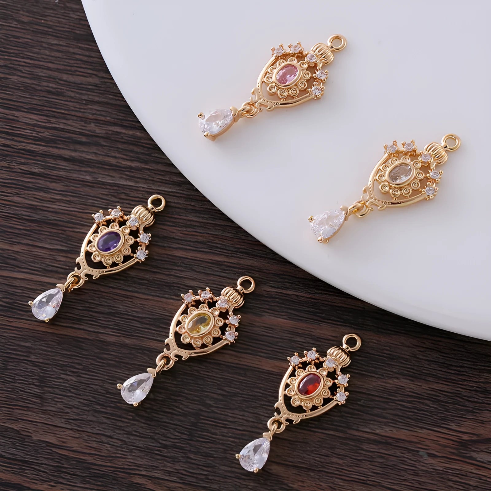 Micro inlaid zircon crown hollow water drop-shaped copper pendant in electroplated colour.