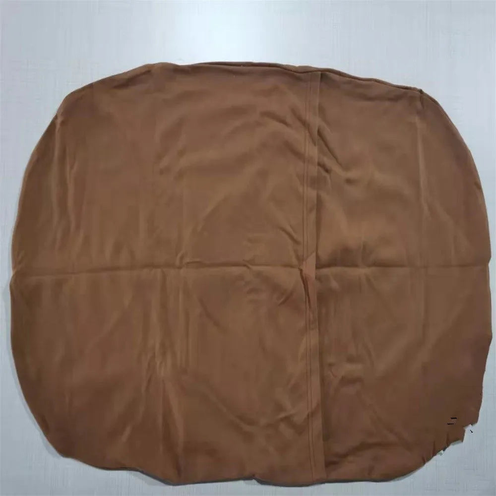 Beige portable baby nest cot crib for infants on a neutral background
