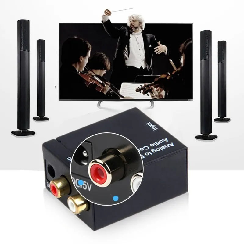 Black digital to analogue audio converter with optical cable and power supply