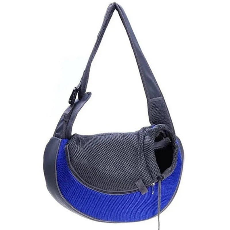 Blue pet carrier backpack for a small dog, showing padded interior and shoulder straps.