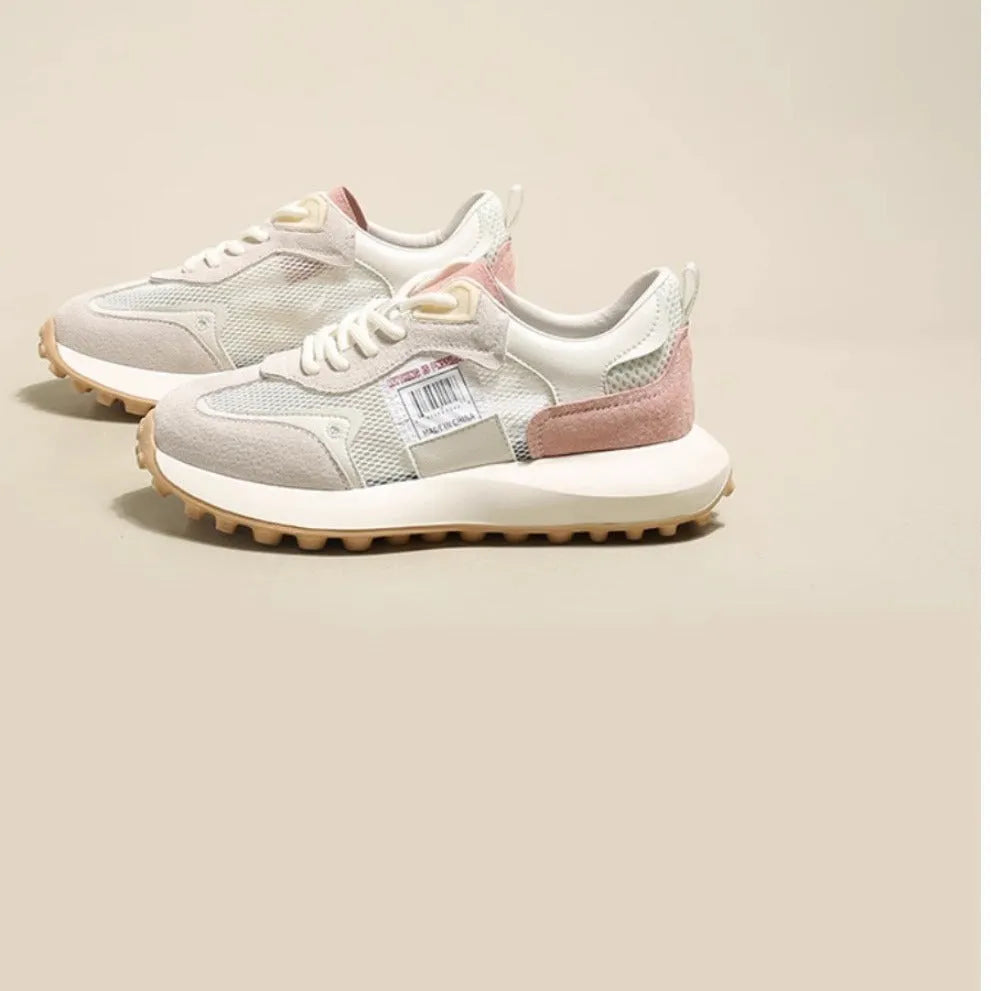 Women's grey and pink retro sneaker with low top design and round toe