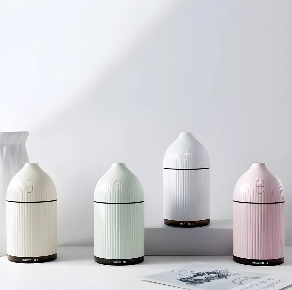 White ultrasonic aromatherapy diffuser and air humidifier with LED light, 300ml capacity, dimensions 80x80x155mm.