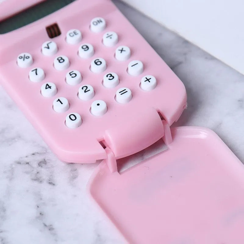 Cookie-shaped mini plastic calculator with key ring, 6.4cm x 3.6cm x 11.2cm, in pink, blue, grey, or black