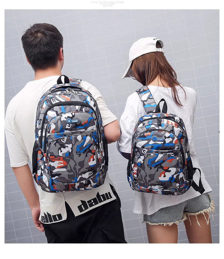 Blue Oxford fabric school backpack with padded black shoulder straps and side pockets.