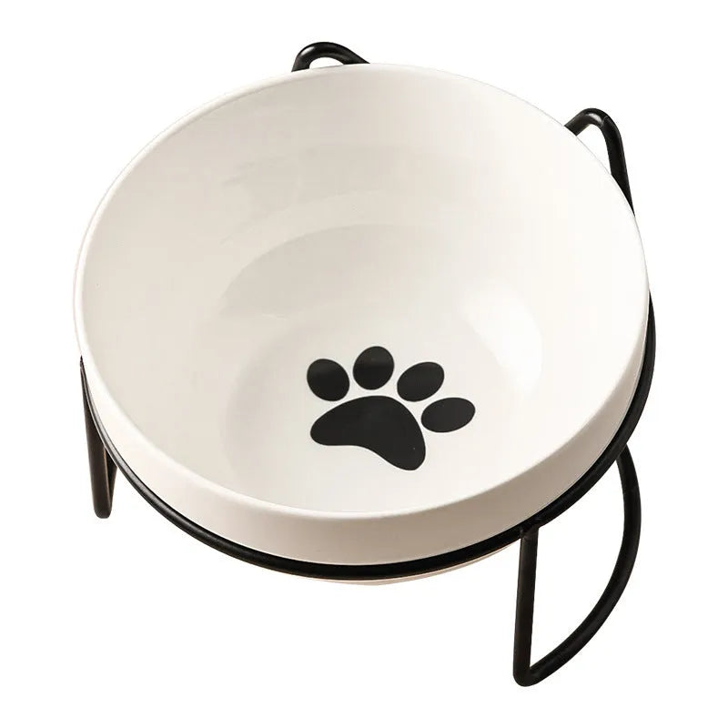 Ceramic cat bowl in an iron frame, showing cat paw print and fishbone pattern options