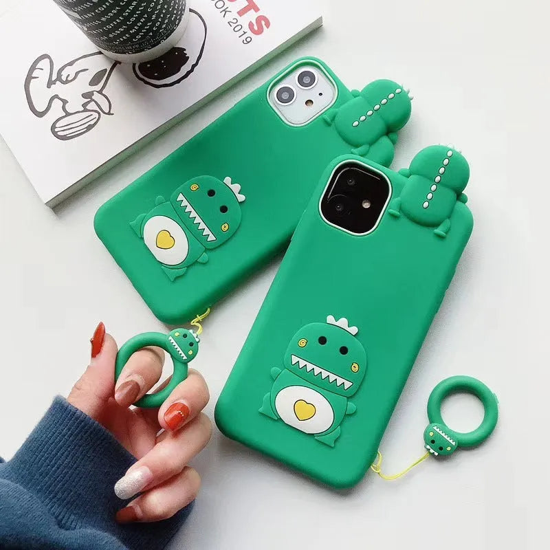 Green and yellow silicone iPhone cases with animal cartoon designs on a white background.