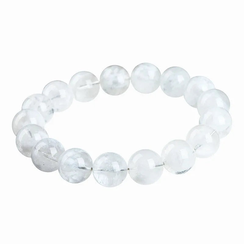 Close-up of a clear crystal blizzard snowflake bead bracelet with Ruyi and Xiangyun design elements.