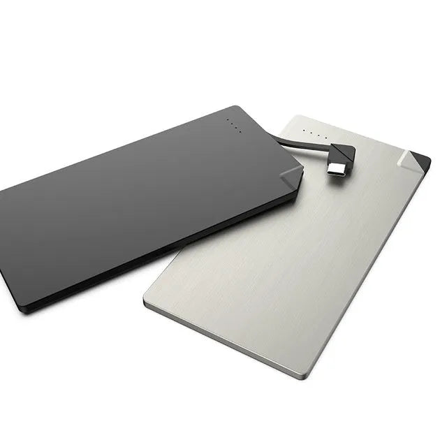 Sliver-coloured graphene battery power bank, 4000mAh capacity, shown next to a mobile phone.