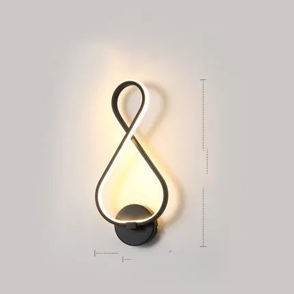 Nordic minimalist LED wall lamp with silicone shade in black finish on a white wall.