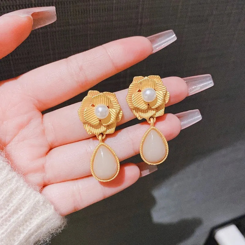Gold electroplated floral stud earrings with opal stone and sterling silver posts in Hong Kong style design