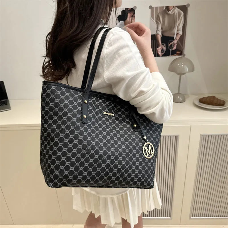 Black PU street-trend shoulder bag with sewing thread detail, shown with a 42cm wide top opening.