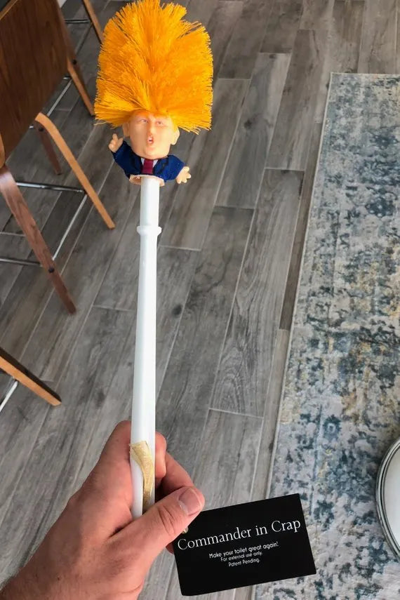 Yellow plastic Donald Trump toilet brush with 40cm length and hanging slot handle