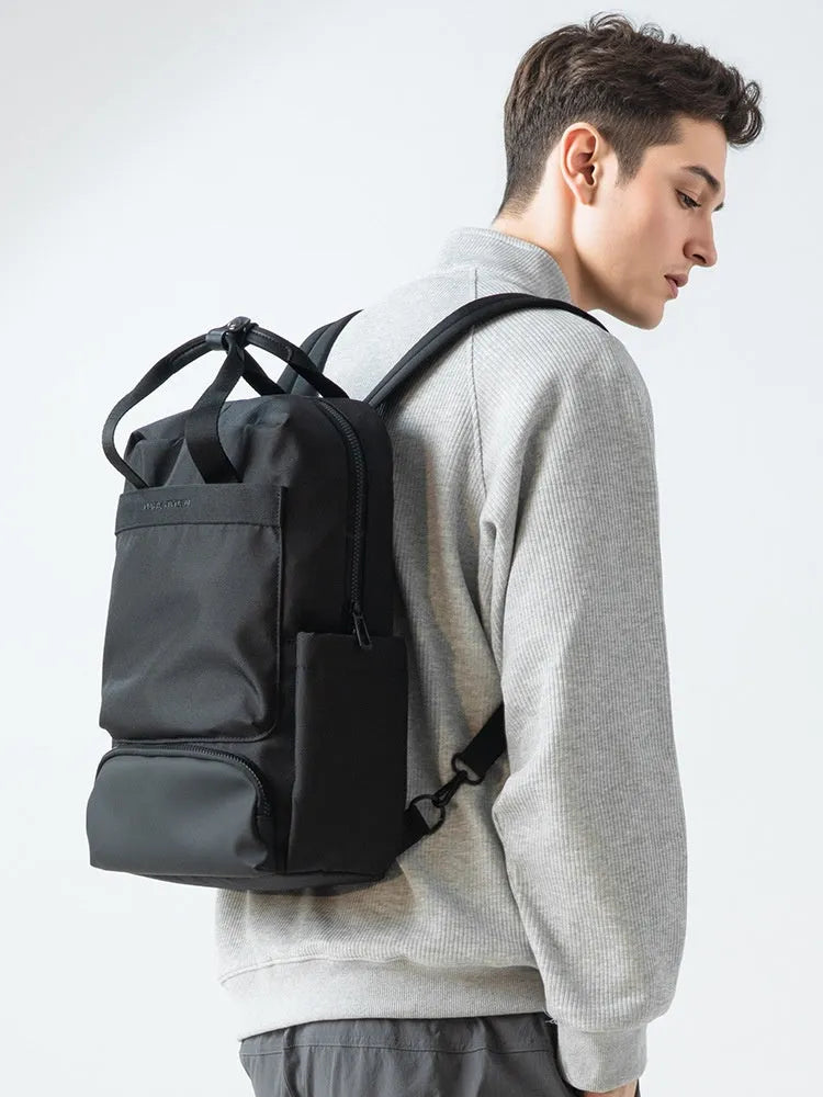 Black Oxford cloth computer backpack showing storage compartments and 20-35 litre capacity