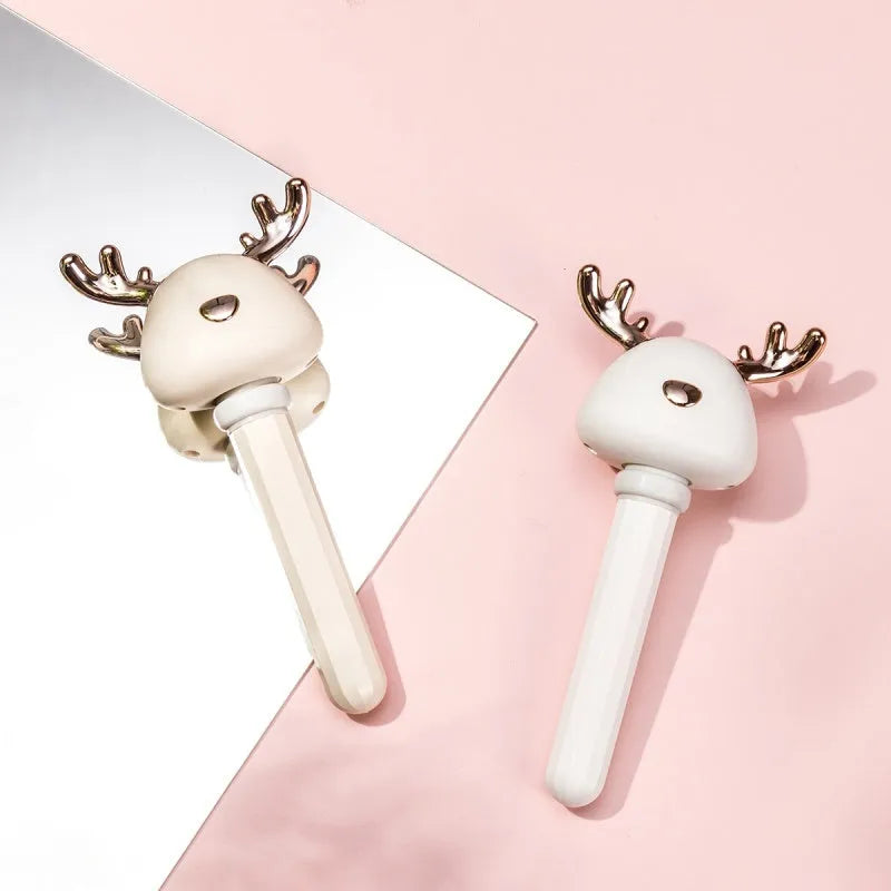 Donut mini humidifier USB car sprayer 54mm x 220mm in ABS and silicone, shown in Beige Elk, Pink Elk, or White