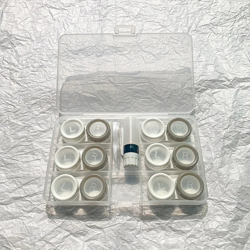 Rectangular contact lens case in various colour combinations including black white and pink white