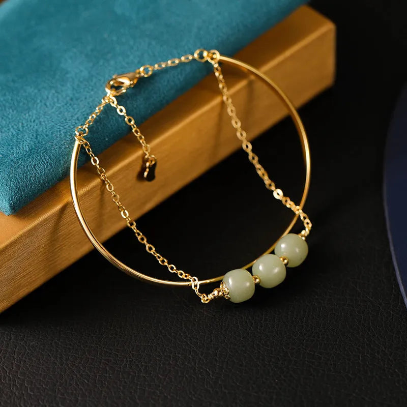 Women's jade lucky beads bracelet with gold inlay design in single, double, and three bead versions
