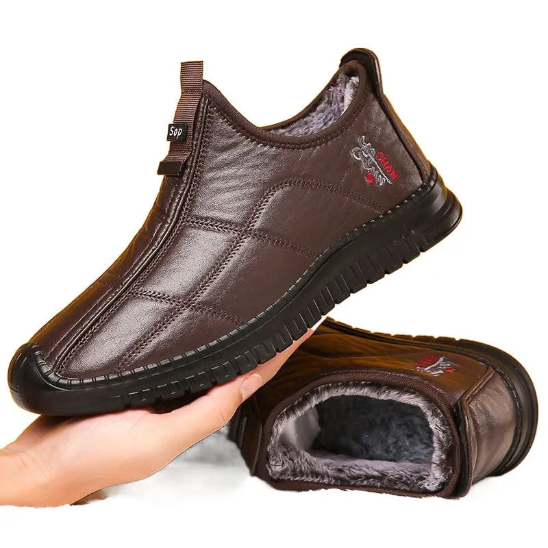 Men's brown buckle-up winter boots with a cotton upper and thick sole on a white background.