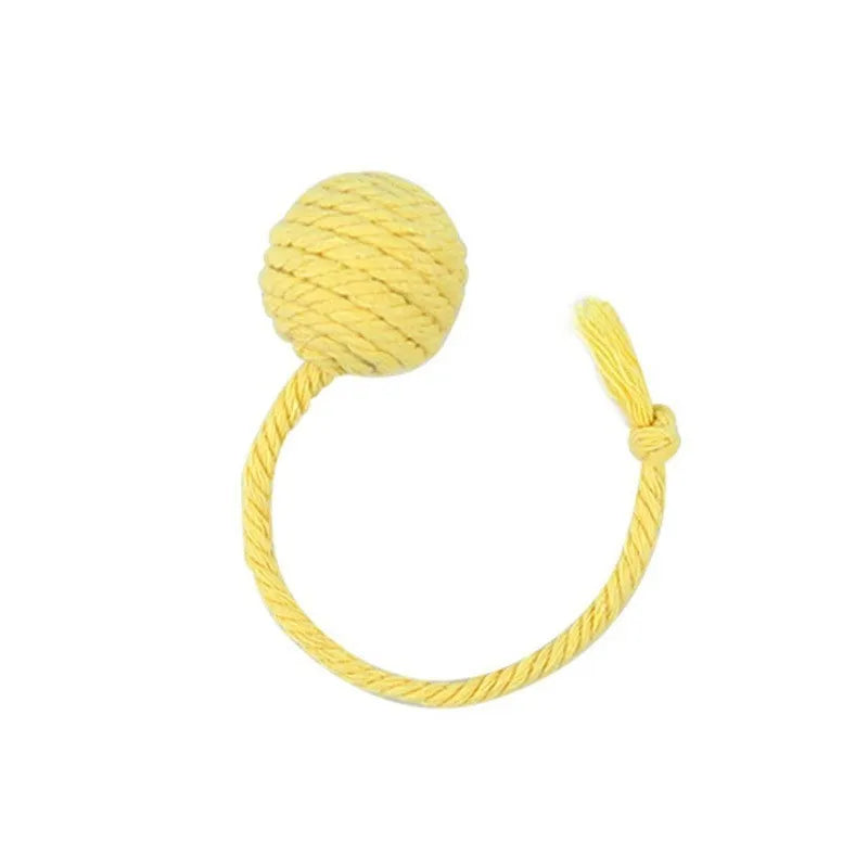Colourful cat toy ball with an attached rope, shown in green, pink, purple, and yellow.