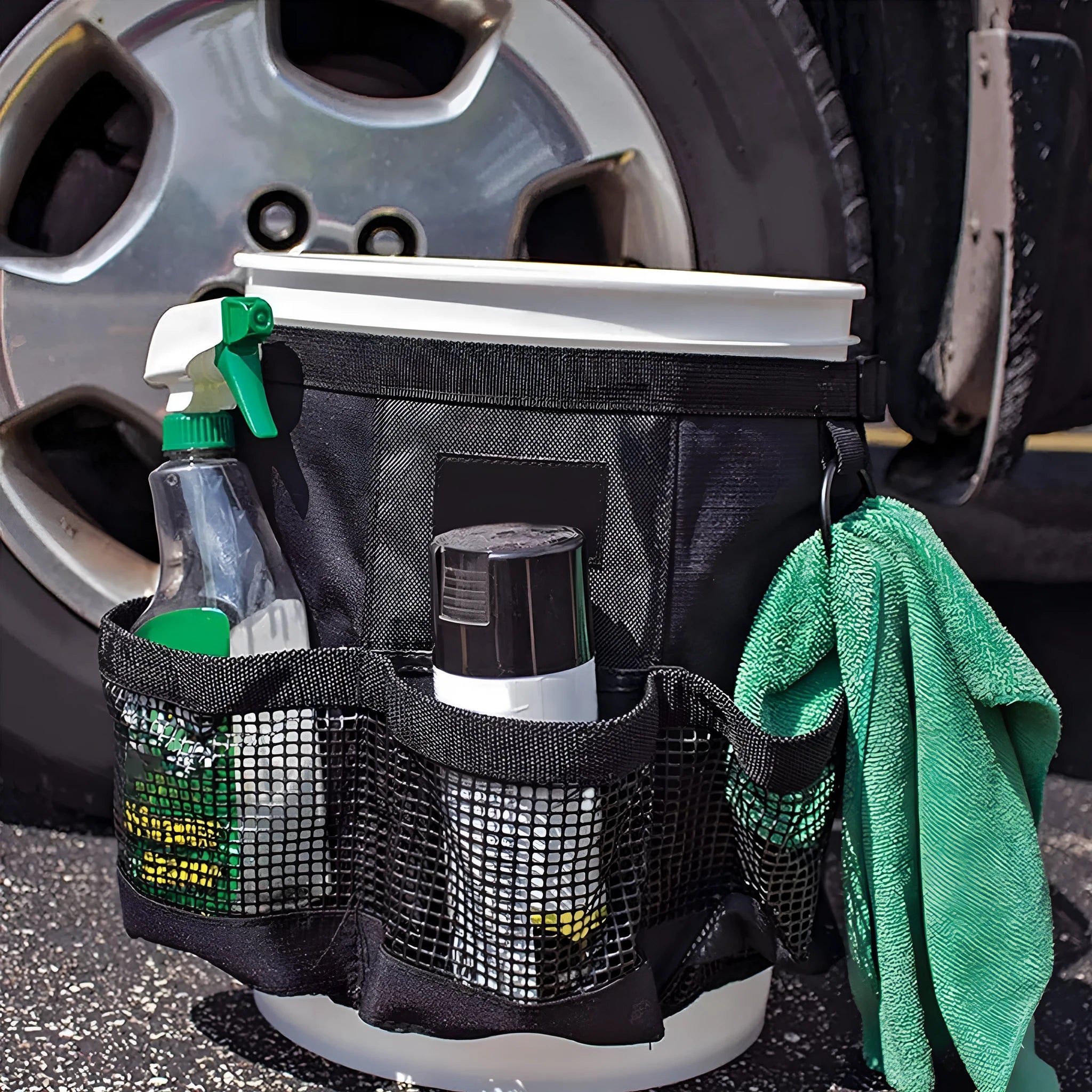 Black cylindrical polyester buggy storage bag hanging from a 5-gallon barrel.
