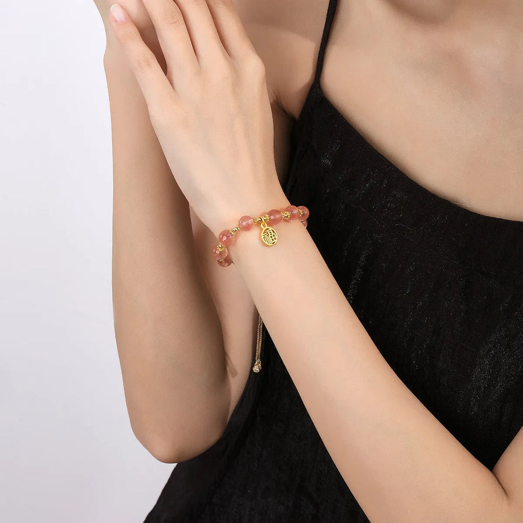Women's strawberry quartz crystal bracelet with geometric shape and silver fu character design