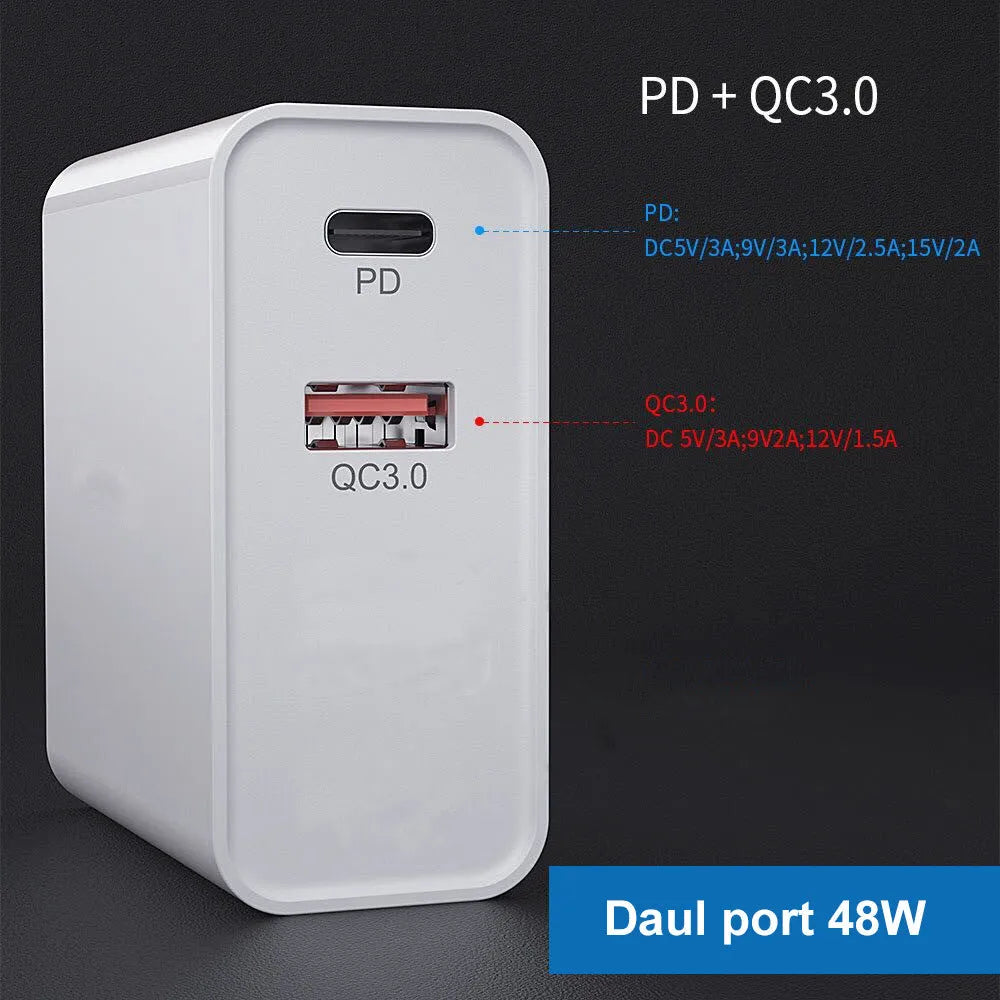 White and black multi-port fast charge USB wall charger with PD and QC support on a wooden surface.