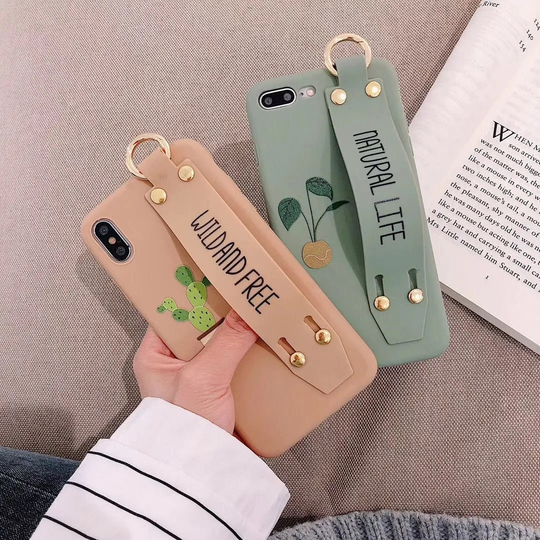 Green graffiti design wristband holder phone case for iPhone showing integrated strap and precise port cutouts