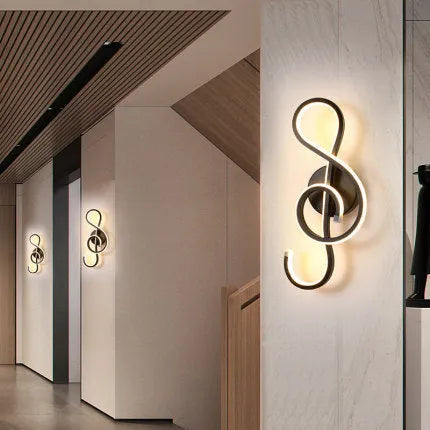 Nordic minimalist LED wall lamp with silicone shade in black finish on a white wall.