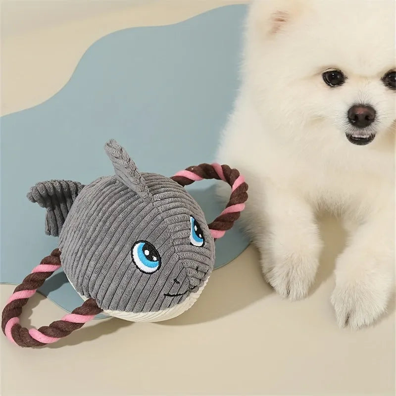 Turtle-shaped plush dog toy with knotted interior and squeaker in grey, green and orange colours