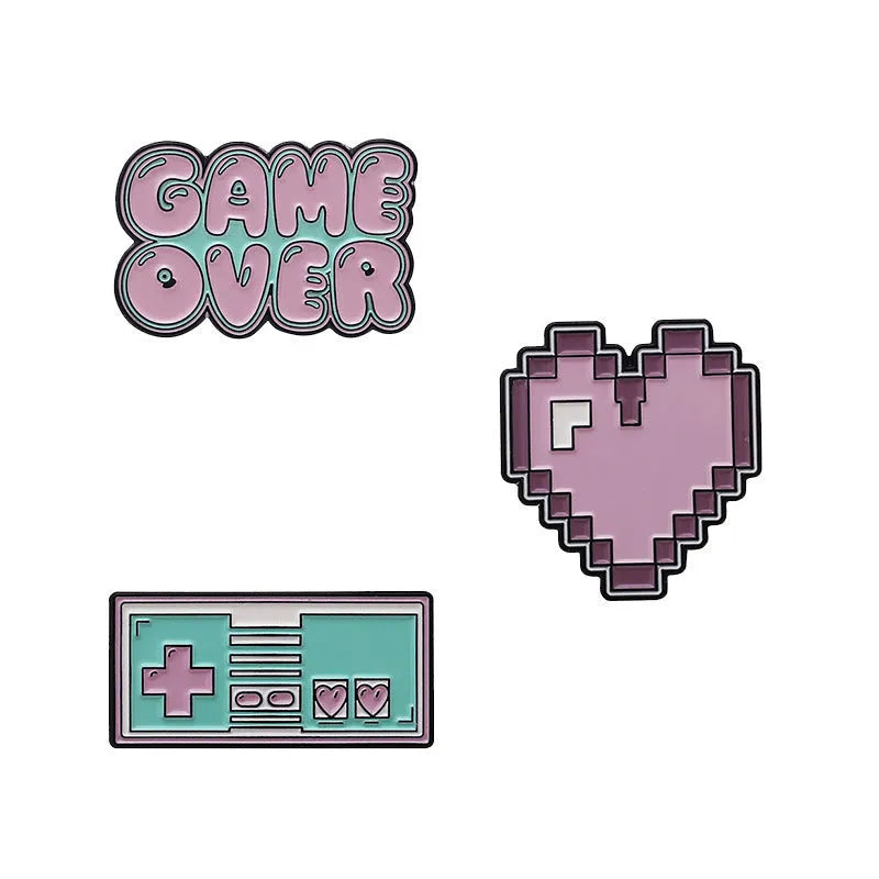 Solid alloy metal game console badge pin on a clear OPP packaging background.