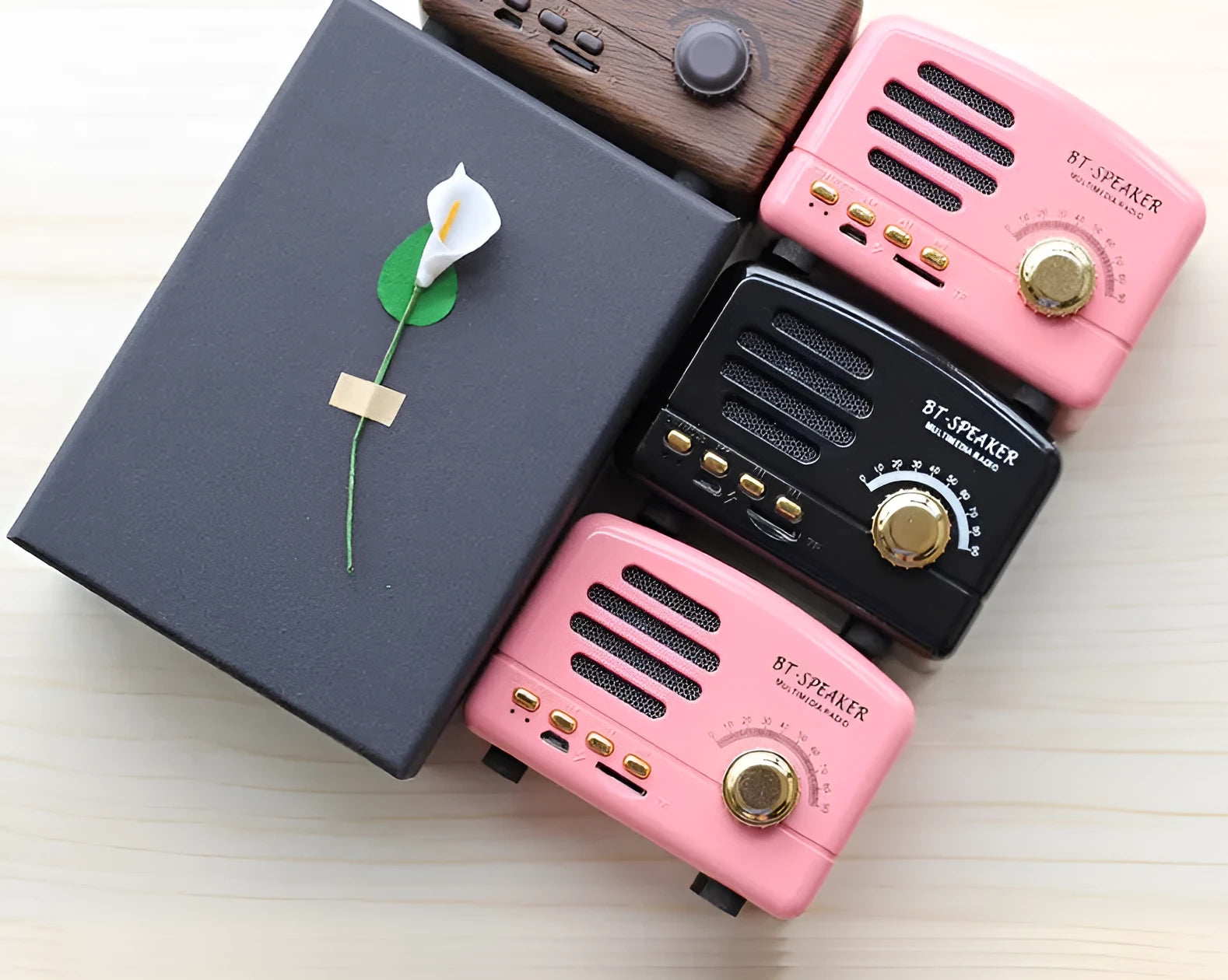 Vintage wood grain Bluetooth speaker with compact design and USB charging cable
