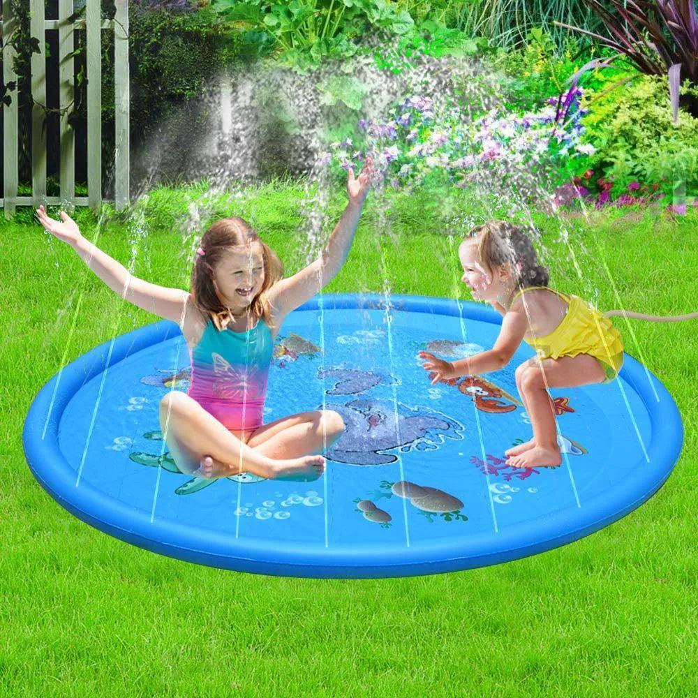 Blue children's water spray play mat with marine animal graphics on grass connected to a hose
