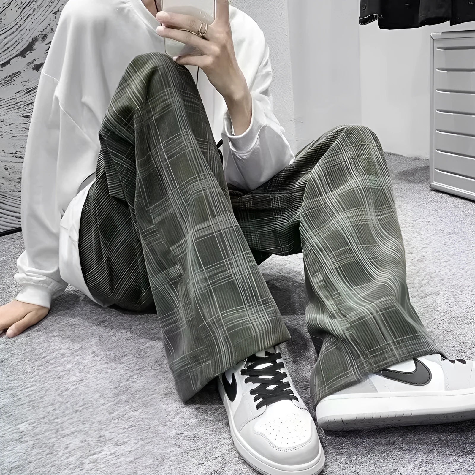 Men's black and green plaid loose fit straight leg trousers with mid waist design