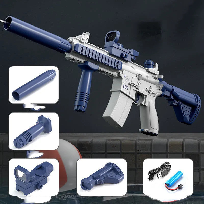 Blue electric water gun toy with USB charging cable on a sandy beach