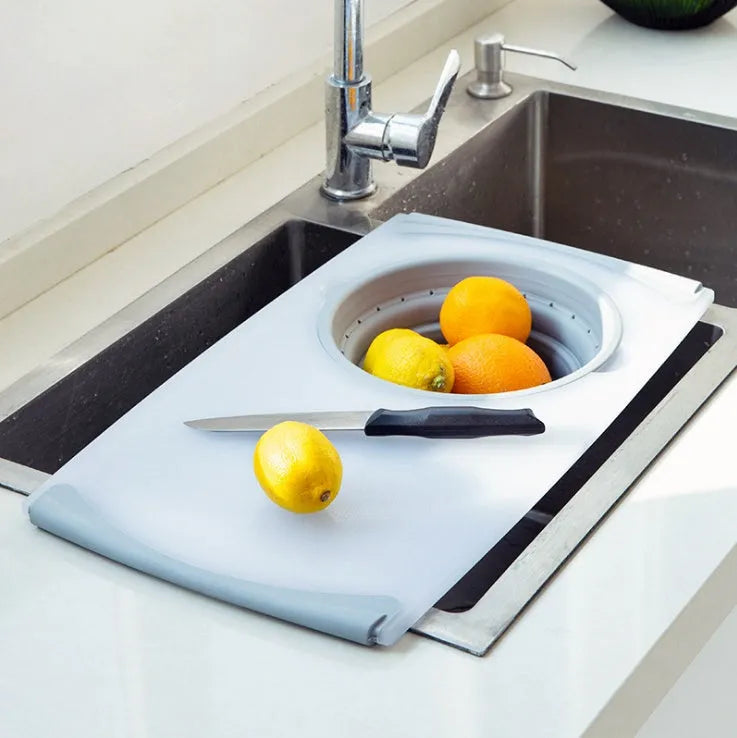 Grey multi-functional chopping board with detachable drain basket showing 50cm cutting surface