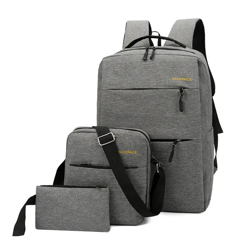 Men's navy blue nylon laptop rucksack with USB port, crossbody bag, and organiser pouch set on a table