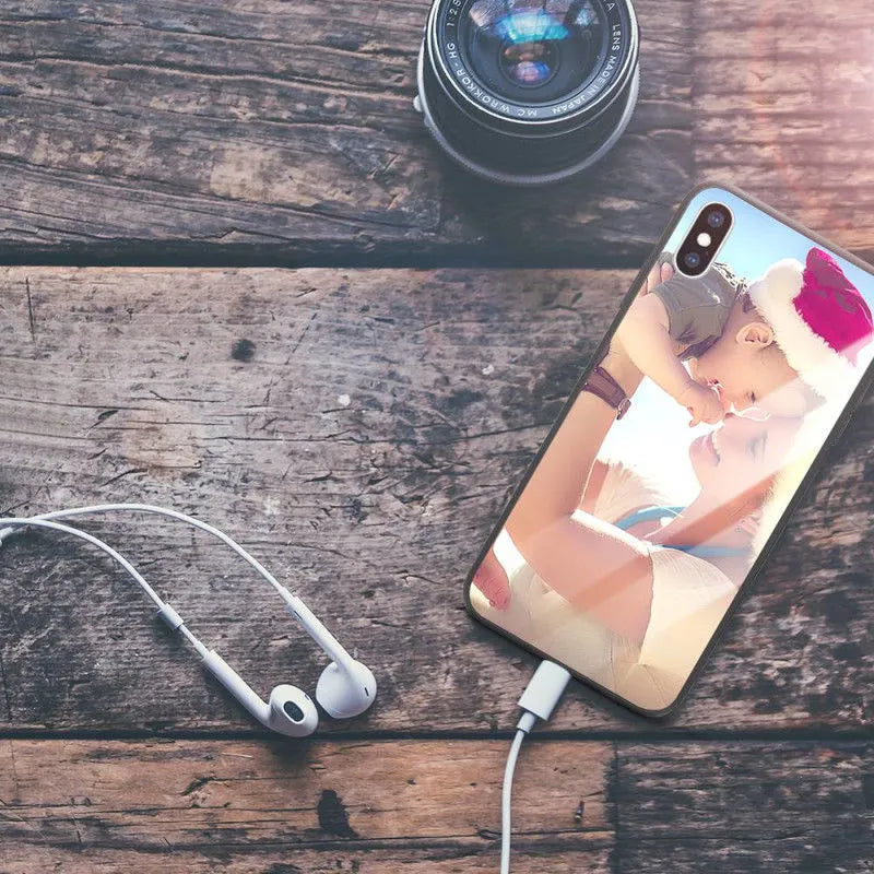 Patterned ultra-thin iPhone case with raised camera bumper edge on a table.