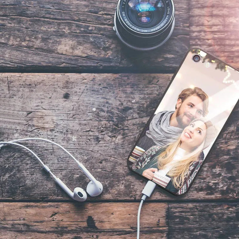 Patterned ultra-thin iPhone case with raised camera bumper edge on a table.