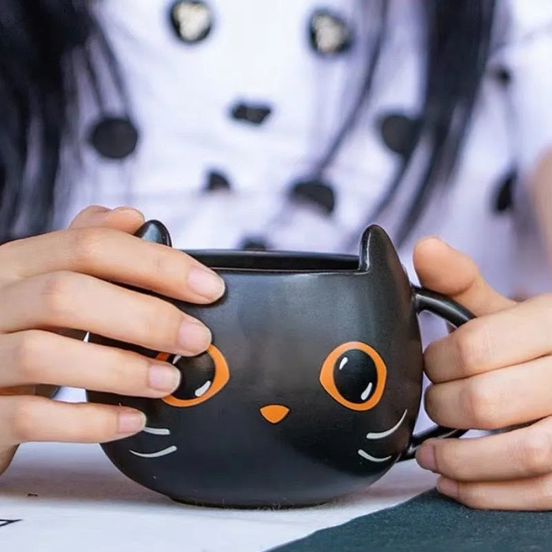 Black cat-shaped ceramic mug with pumpkin decoration and 355ml capacity