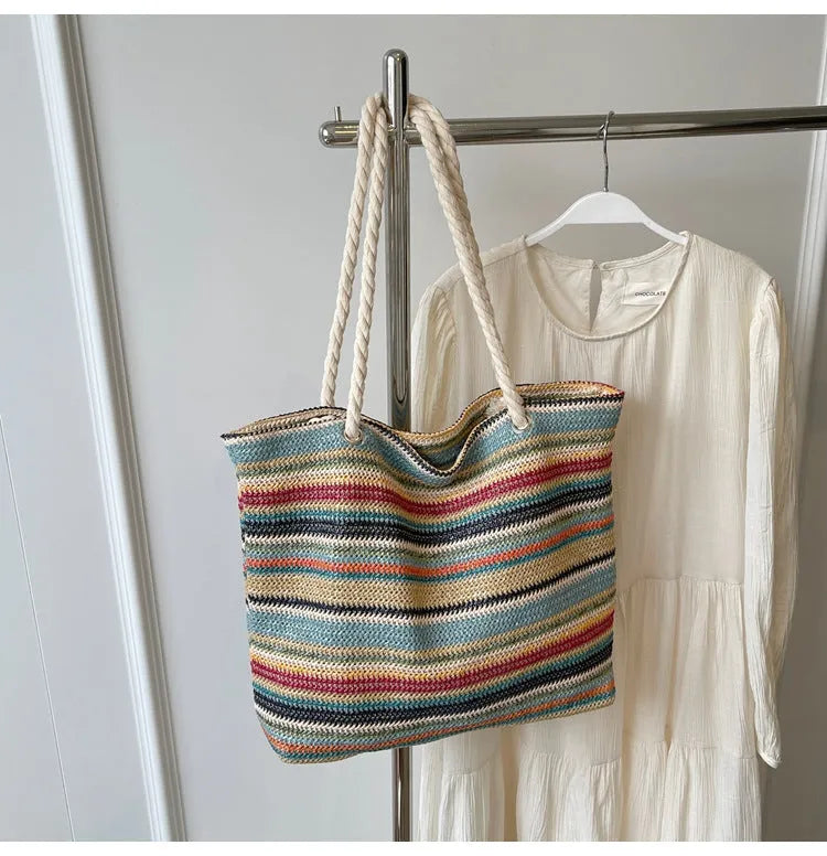 Blue woven nylon shoulder bag with straw-weave pattern and adjustable strap