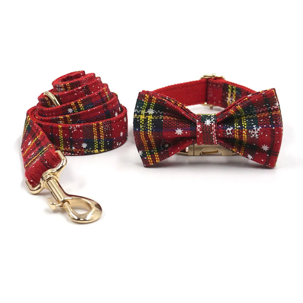 Red Christmas dog suit set with collar, leash, bow, and chest-back harness on a festive background.