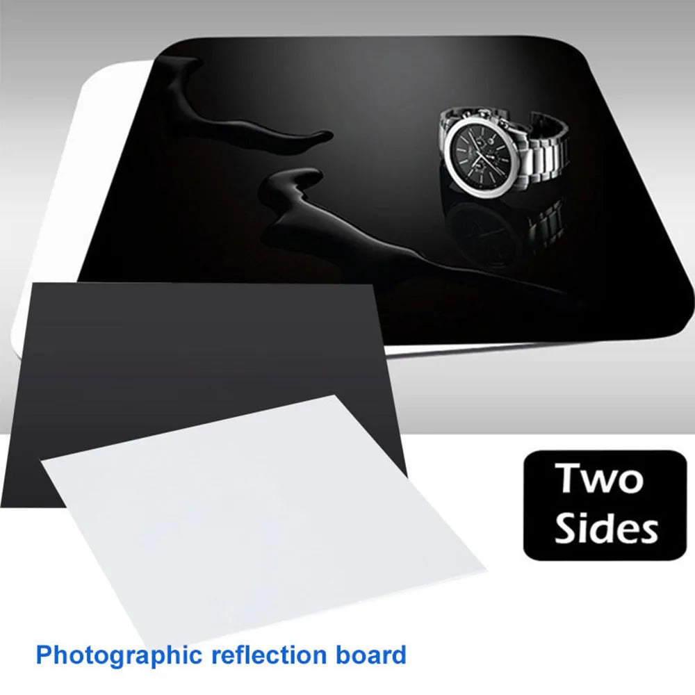 Square black and white acrylic shooting reflection boards for photography in three sizes on a table.